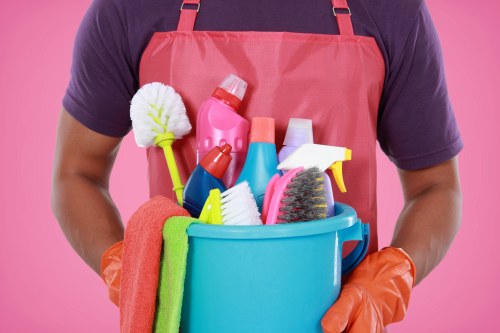 Professional carpet cleaner at work with modern equipment